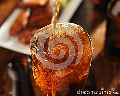 Pouring beer into glass Stock Photo