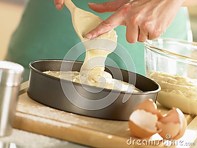 Pouring Cake Mixture Into Baking Tin Stock Photo