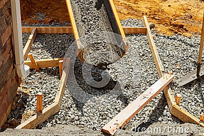 Pouring cement during sidewalk upgrade Stock Photo