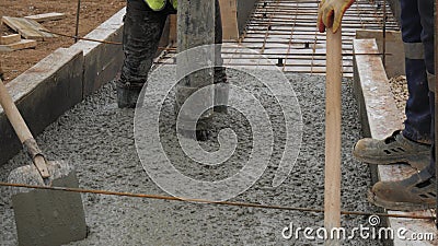 Pouring Concrete Mix From Cement Mixer On Concreting Formwork