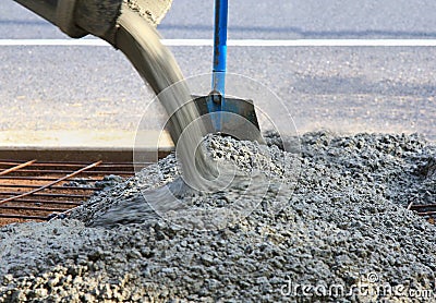 Pouring concrete view of shovel and steel Stock Photo