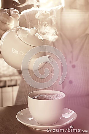 Pouring The Cup Of Tea Stock Photo