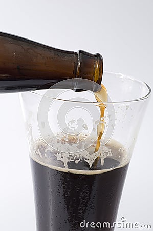 Pouring a Dark Beer Stock Photo