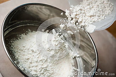 Pouring flour powder for panning Stock Photo