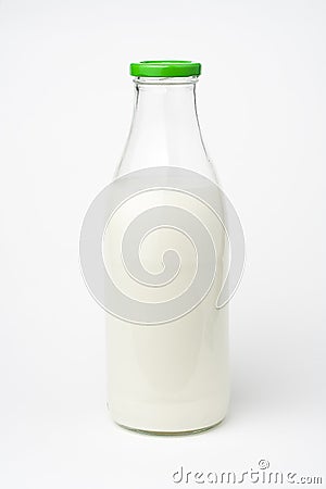 Pouring fresh glass of milk isolated Stock Photo