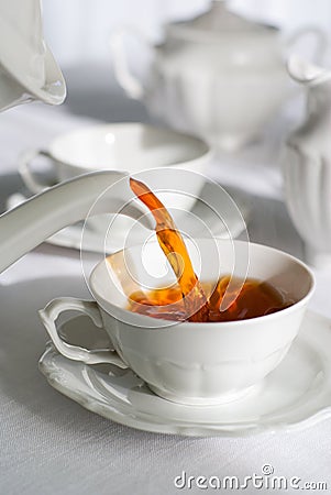 Pouring fresh tea. Stock Photo