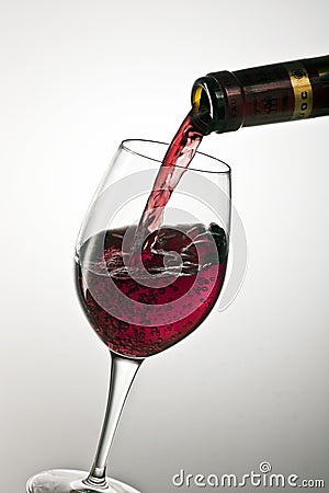 Pouring a glass of red wine Editorial Stock Photo