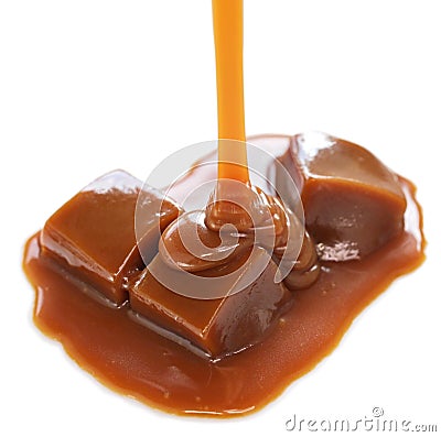 Pouring homemade caramel sauce on caramel candies Stock Photo