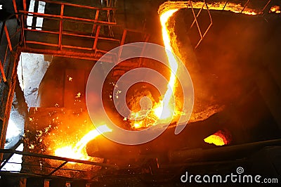 Pouring molten steel in transportation device Stock Photo