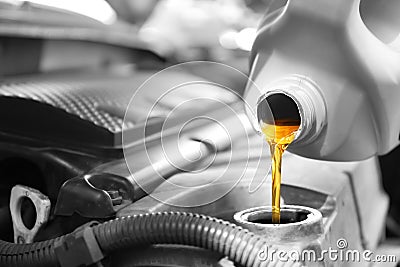 Pouring oil into car engine Stock Photo