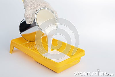Pouring paint into a painting tray Stock Photo