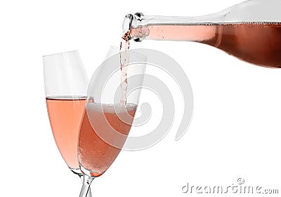 Pouring rose champagne from bottle into glass Stock Photo