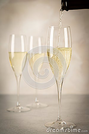 Pouring sparkling wine Stock Photo