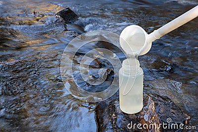 Pouring water sample for environmental study Stock Photo