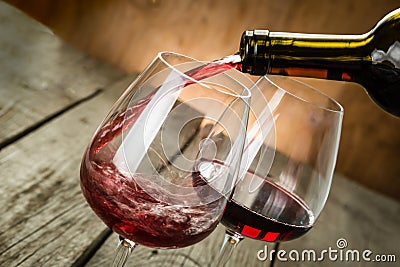 Pouring wine in a glass Stock Photo