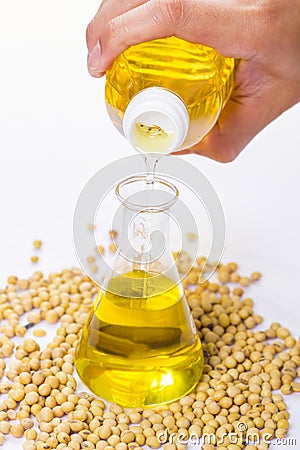 Pouring yellow soya bean oil Stock Photo