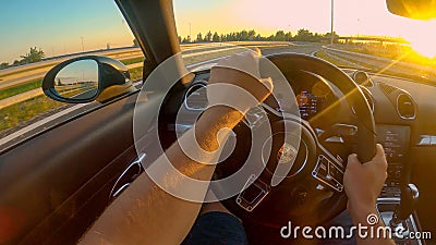 POV: First person shot of cruising down the freeway in a Porsche at sunset. Editorial Stock Photo
