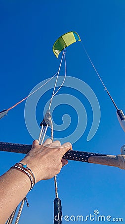 POV: Holding on to the handle of a kite while kiteboarding in Croatian seaside. Stock Photo