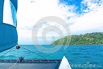 POV of traveling to island by Sailboat Stock Photo