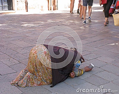 Poverty and begging, woman with paper cup Editorial Stock Photo