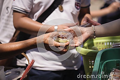 Poverty concept feeding food for beggar Stock Photo