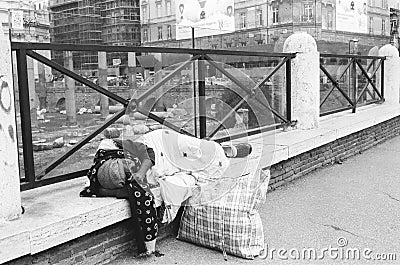 Poverty, homeless woman sleeping on the street. Editorial Stock Photo