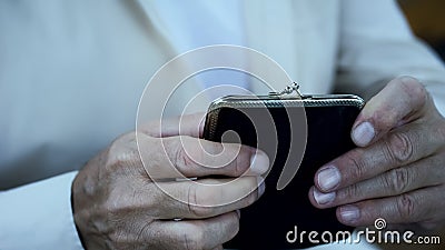 Poverty, pensioner holding empty wallet, default and bankruptcy, economic crisis Stock Photo