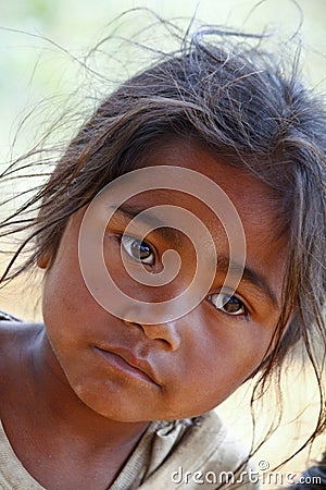 Poverty, portrait of a poor little African girl lost in deep tho Stock Photo