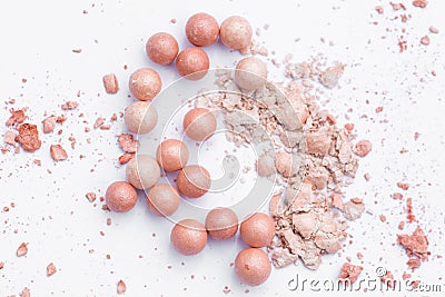 Powder in the balls with a radiant effect on the background of the set for blush. Make-up cosmetics, Stock Photo