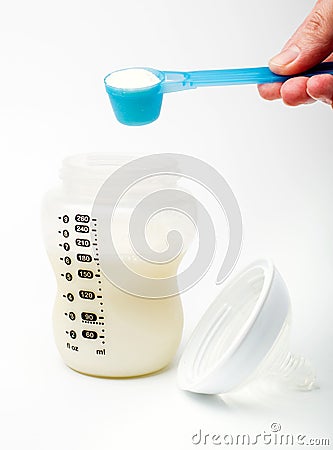 Powdered milk with spoon Stock Photo