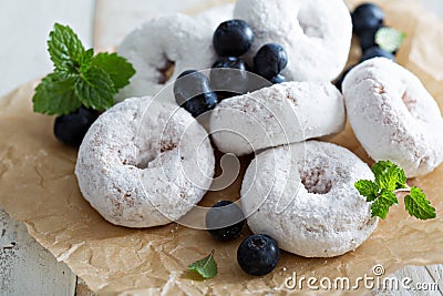 Powdered sugar donuts on parchment Stock Photo