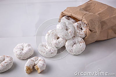 Powdered sugar mini donuts from a bag- carnival or summer fair food Stock Photo