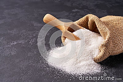 white sugar in bag on black background Stock Photo