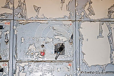 The power button and knob toggle switch to control industrial equipment at the factory on the background of a wall with shabby Stock Photo