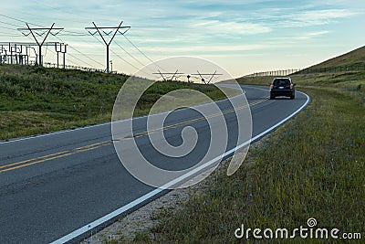 Power Electrical Lines From Hydro Electric Plant by Road and Fields with Car Stock Photo