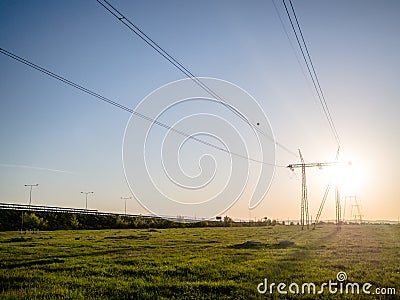 Power grid and electric wires in sunset Stock Photo