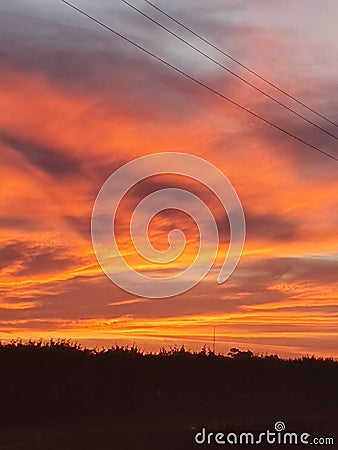 Power line orange winds cloudy clouds Stock Photo