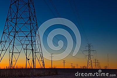 Power line towers during blue hour Stock Photo