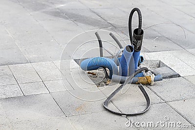 Power line underground works in street with electricity cables Stock Photo