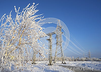 Power lines clear afternoon in frost outside the city. Stock Photo