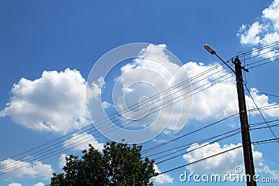 Electric power pole and high voltage cables. Stock Photo