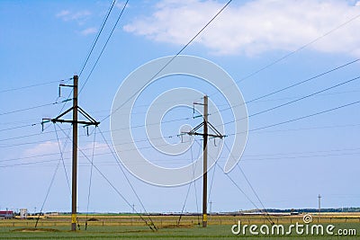 Power lines and pylons in a rural area Stock Photo