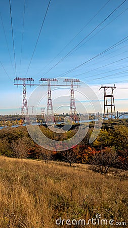 Power lines transmit electricity by wire, high voltage Stock Photo