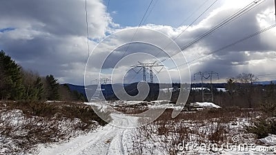 The power lines during a winter snowmobile ride Stock Photo