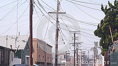 Power lines or wires on poles California city street, USA. Electricity supply. Stock Photo