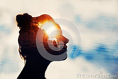 Power of mind concept. Silhouette of smart girl. Stock Photo