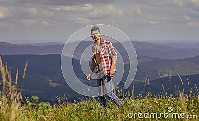 Power of nature. Man unbuttoned shirt stand top mountain landscape background. Strong hiker muscular torso. Athlete Stock Photo