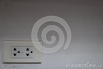 Power outlets with Spider`s wavy on a dirty white wall at one corner of the room Stock Photo