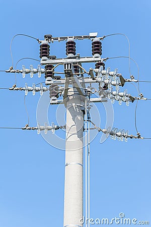 Power pole with external electric separator on top Stock Photo
