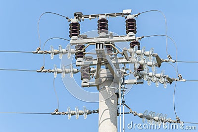 Power pole with external electric separator on top Stock Photo